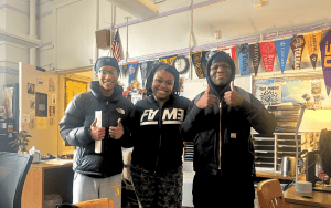 Three smiling members of the Men's Leadership Group
