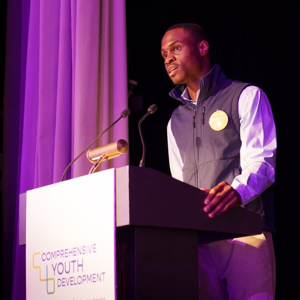 Alumni Dan giving speech at event