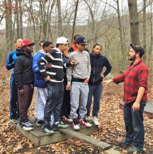 mens group gathered in forest