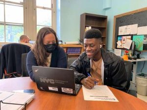 Joseph "Junior" Jean-Paul speaks with Hattie Hill, Director of Post-Secondary Services
