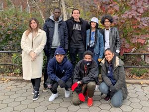 Outdoor group photo of eight CYD students