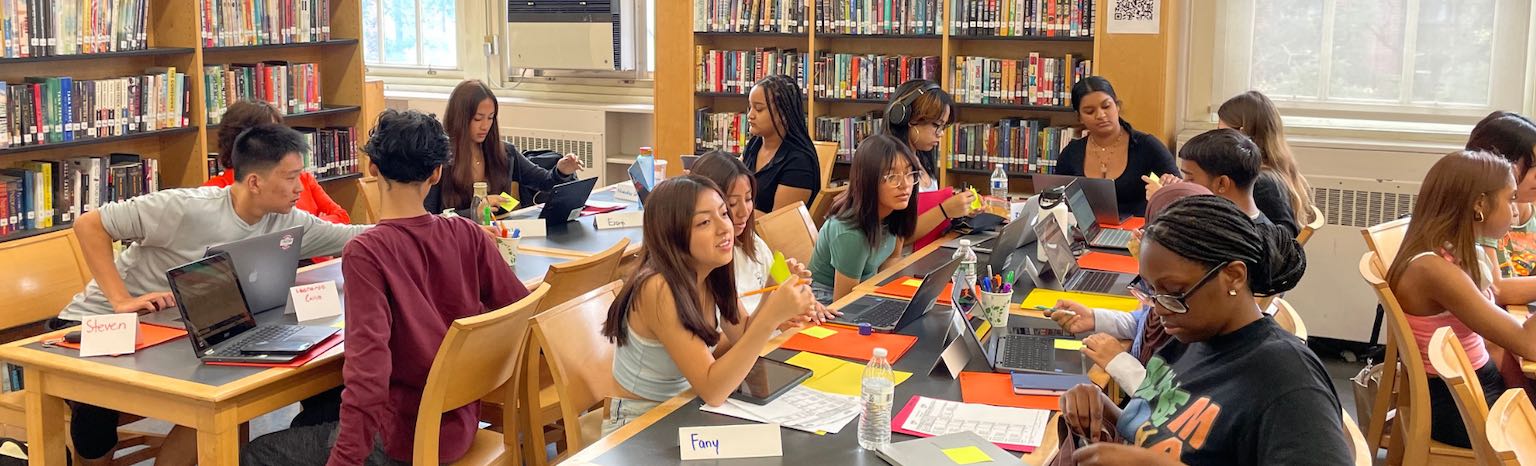 group of students at tables in library