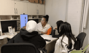 students working with counselor