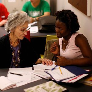 Lois Lowenstein works with student