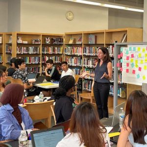 Rachel Potts speaking with students