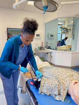 Career Academy student working in medical simulation lab
