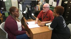 student presents math portfolio to teachers